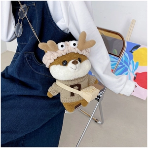 Plush Shiba Inu crossbody bag featuring antlers and a sweater worn by a model