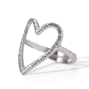 Detail of silver heart-shaped ring with hammered texture and open adjustable band