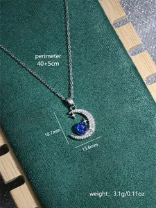 Detail of silver crescent moon planet necklace with dimensions 18.7mm and 40+5cm chain