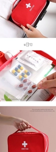 Macro detail of red first aid kit interior compartments for medical supplies storage