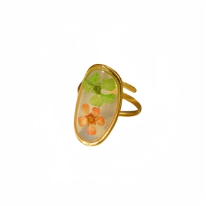 Gold stainless steel oval ring with green and orange dried flowers in resin