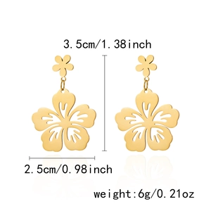 Detail view of golden flower shell earrings with dimensions 3.5cm length and 2.5cm width