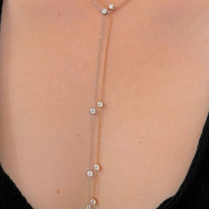 Elegant two-tone Y-shape long necklace with zircon pendants on a model's neckline