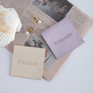 Microfiber jewelry envelope pouches in lavender and beige with pearl earrings