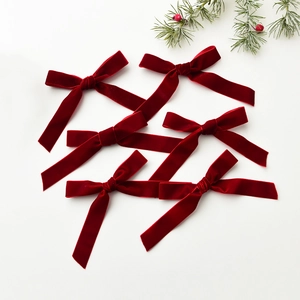 Set of 6 mini red velvet Christmas bows for DIY tree decoration with pine branches
