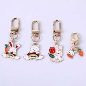 Detailed view of four colorful enamel zinc alloy rabbit and bear keychains set