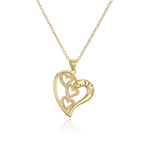 Close-up of gold heart pendant with zircon accents and engraved LOVE lettering