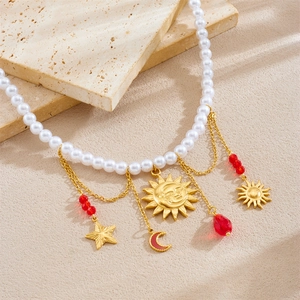 Vintage gold-plated stainless steel necklace with pearl chain and celestial sun moon charms