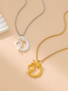 Close-up of hip-hop dragon pendants in gold and silver finish with detailed chains