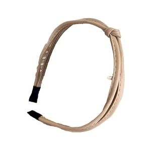 Minimalist beige leather knotted headband for women with a sleek and versatile design