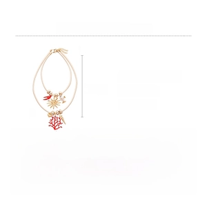 Detail of layered beach necklace with faux shell, coral charms, and leather cord