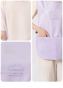 Detail view of breathable mesh back and adjustable side buckle on purple kitchen apron
