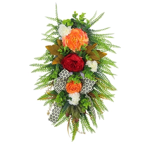 Autumn harvest floral wall wreath with orange peonies and black white ribbon decoration
