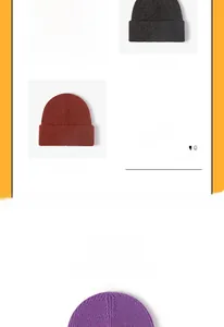 Close-up of ribbed knit beanies with N patch in cream, grey, rust red and purple