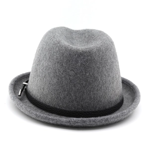 Detail of dark grey wool felt fedora with a black leather band and silver buckle