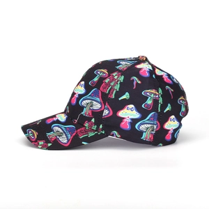 Close-up of baseball cap featuring colorful mushroom patterns on a black background
