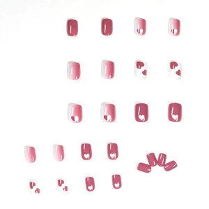 Short square pink and white gradient press-on nails with raspberry heart graffiti art