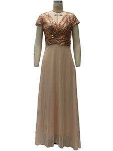 Close-up of rose gold sequin bodice with V-neckline and pleated waist detail
