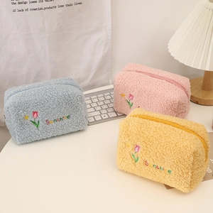 Detailed view of plush tulip cosmetic bags in pink blue and yellow soft lamb fleece material