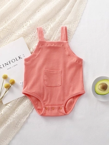 Sleeveless ribbed cotton baby bodysuit in coral pink with pocket and snap buttons