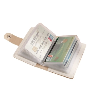 Cream white accordion card holder with multi-slot PVC pages and metal snap closure