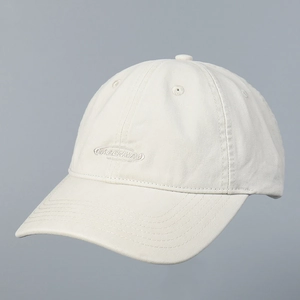Macro view of NIBENARA embroidery and reinforced stitching on cream baseball cap