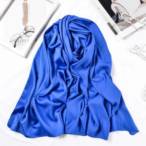 Detail of blue matte satin silk scarf texture with elegant lifestyle fashion props
