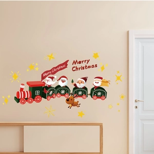 Detail of Santa and reindeer wall stickers with Merry Christmas text on a warm indoor wall