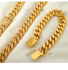 Macro view of gold-plated Cuban link chain with pave crystal and polished metal details