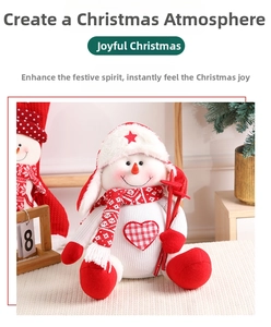 Detail of Christmas snowman plush doll with knit scarf, earflaps and red ski poles