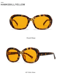 Macro view of vintage hawksbill oval sunglasses with yellow lenses and metal rivets