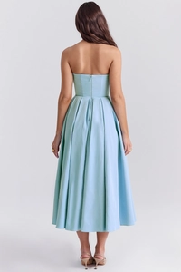 Rear view of light blue backless midi dress showing the sleek zipper and fit details