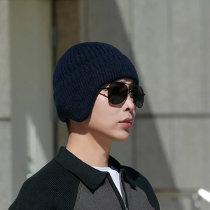 Winter men's navy blue knitted hat with ear protection and warm fleece lining