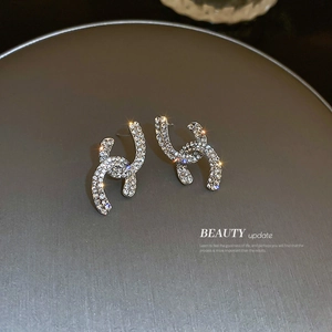 Silver needle pavé diamond interlocking cross stud earrings with sparkling crystals