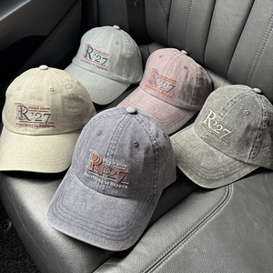 Collection of vintage washed cotton baseball caps with embroidered R'27 text in five colors