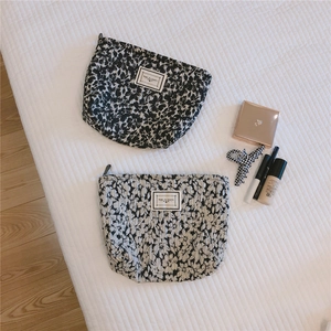 Quilted floral makeup bags in black and white with Time To Party woven label detail