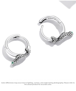 Detailed view of S925 sterling silver snake hoop earrings with green zircon eyes