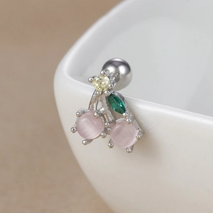 Macro detail of cherry stud earring with pink cat-eye stones and screw back closure