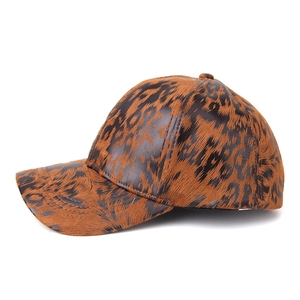 Close-up of the leopard print texture and curved brim on the stylish baseball cap
