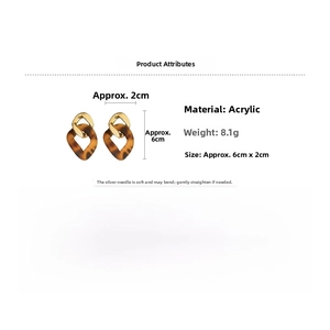 Detailed view of leopard print acrylic drop earrings with gold chain and 6cm dimensions