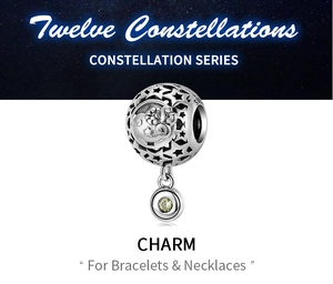 Detail of S925 sterling silver Aries charm with hollow stars and green gemstone