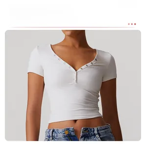 Close-up of white V-neck yoga shirt with silver button details and double-layer fabric