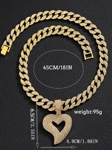 Detailed view of iced out heart pendant on gold Cuban chain with 45cm 18in size labels