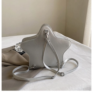 Close-up of silver star-shaped backpack with metallic texture and adjustable straps
