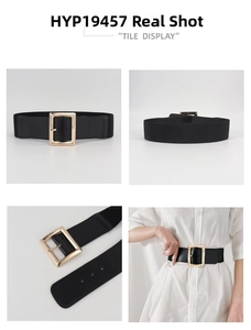 Detail view of wide black elastic waist belt with large polished gold square buckle
