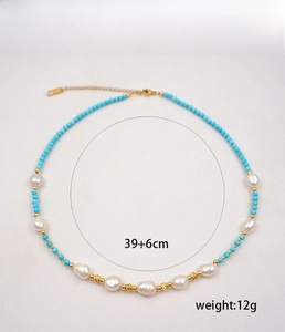 Detail view of turquoise beads and freshwater pearls necklace with size specifications