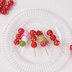 Funny simulation candied haws and tricolor dango hair clips on a transparent glass tray