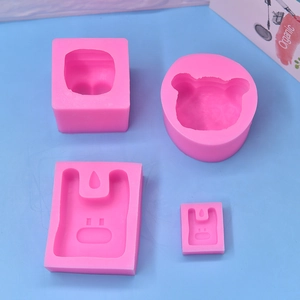 Pink silicone mold set for soap and candles featuring rabbit and bear head shapes