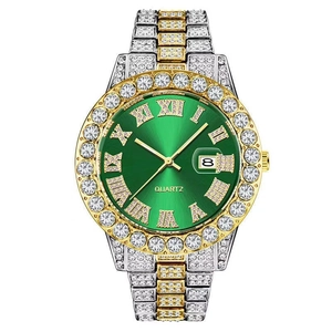 Macro shot of hip hop iced-out watch showing green dial and calendar date window