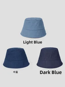 Three shades of denim bucket hats in light blue, medium blue and deep blue options
